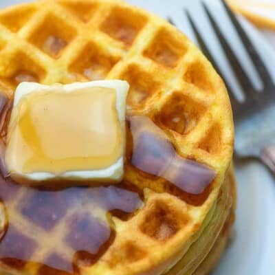 A plate of food with a fork, with Waffle