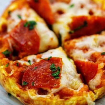 sliced pizza on baking sheet.