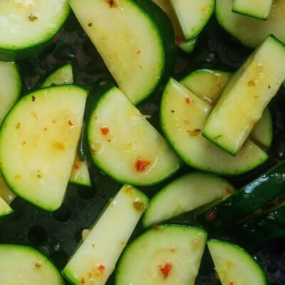 zucchini in air fryer basket.
