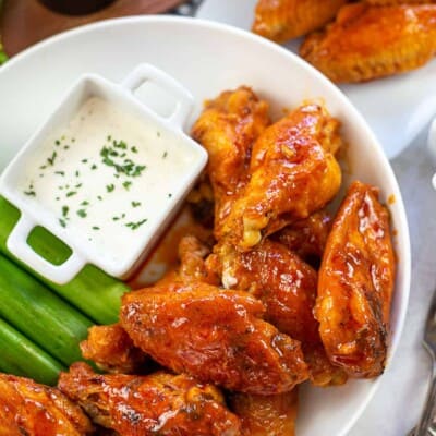 buffalo chicken wings in white bowl.
