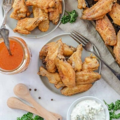 overhead view of chicken wings on plates.