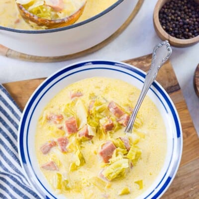 Overhead view of bowl full of ham and cabbage soup.