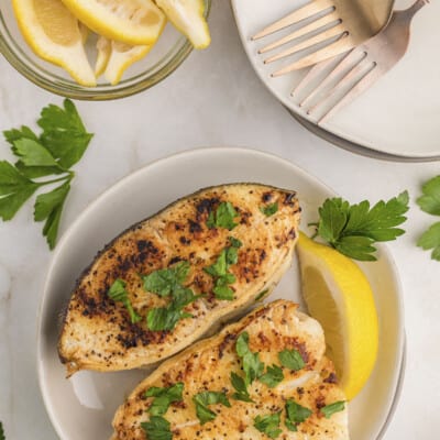 Halibut steaks on small plate.